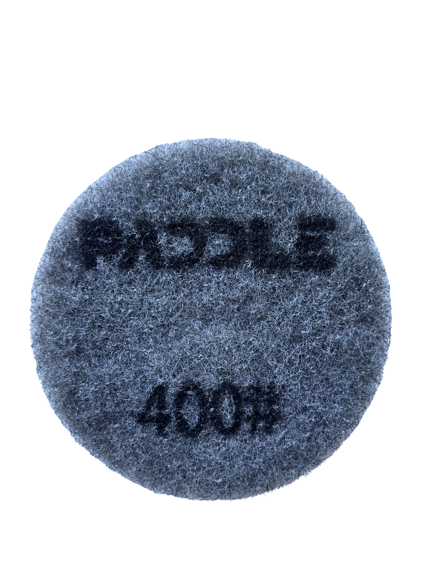 230mm resin polishing pad in use on walk behind concrete floor grinder