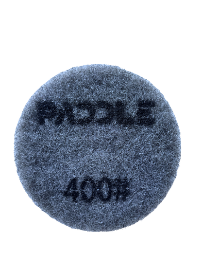 230mm resin polishing pad in use on walk behind concrete floor grinder