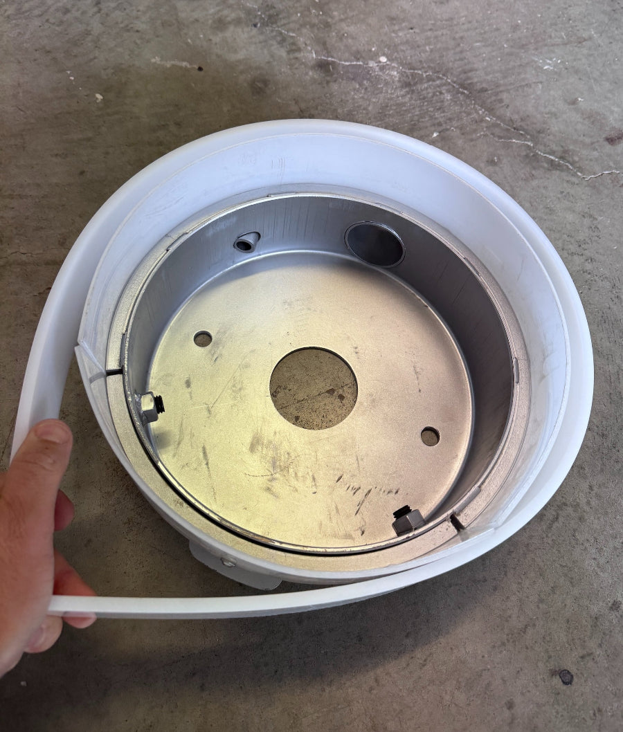 Flexible dust shroud skirt installed on 250mm floor grinder to contain fine concrete dust