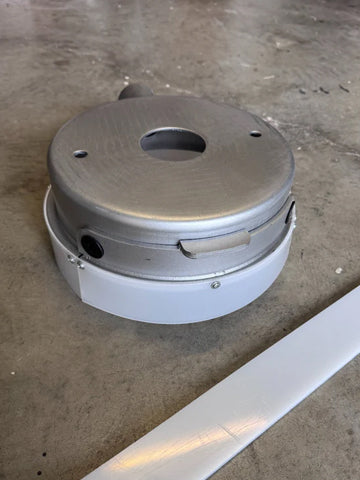 White flexible plastic dust shroud for 250mm floor grinder used for dust control during concrete grinding